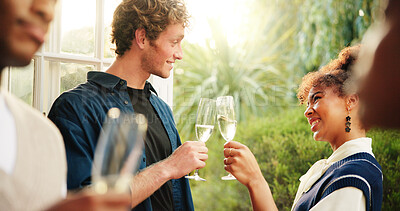 Buy stock photo Couple of friends, party and toast with champagne, relax or reunion at new year event in house. Wine glass, cheers or happy people at celebration for social gathering with alcohol for holiday at home