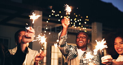 Buy stock photo Outdoor, night and happy as friends with sparklers for new year and festive season celebration. Dark, people and excited or fun for gathering with fireworks for special occasion, event and festival