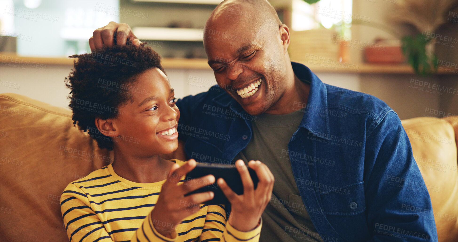 Buy stock photo Playing, dad and child with smartphone, home and bonding with video game, laughing and fun for score. House, man and gamer with mobile app in lounge, African and boy with hobby, subscription or break