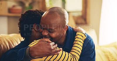 Buy stock photo Bonding, hug or love with dad and son on sofa in living room of home together for development. Black family, happy or support with boy child and single parent man embracing in apartment for caring