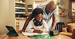 Father, boy and smile with homework, learning and support for development, notes and advice in house. African man, child and scholarship with tablet, writing and online course at black family home