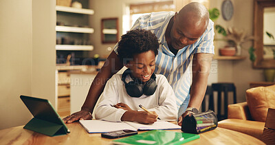 Buy stock photo Father, boy and smile with homework, learning and support for development, notes and advice in house. African man, child and scholarship with tablet, writing and online course at black family home