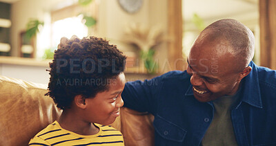 Buy stock photo Bonding, smile or talking with dad and son on sofa in living room of home together for development. Black family, happy or love with boy child single parent man in apartment for advice or chatting