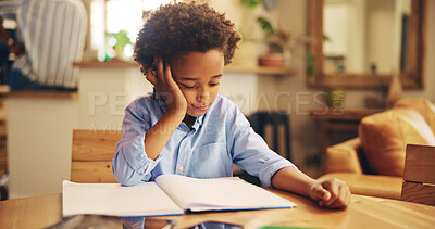 Buy stock photo African boy, books and bored with homework, frustrated or learning disability with thinking in family home. Kid, notebook and annoyed with reading, study or tired with dyslexia for education in house