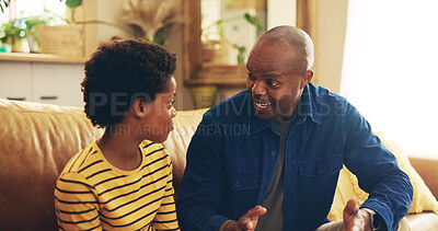 Buy stock photo Advice, smile or talking with dad and son on sofa in living room of home together for development. Black family, happy or love with boy kid and single parent man in apartment for bonding or chatting