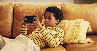 Buy stock photo Black child, streaming and smartphone for educational games, growth and development in home. Kids, mobile tech and esports for creativity, fun and social media with application, download and playing