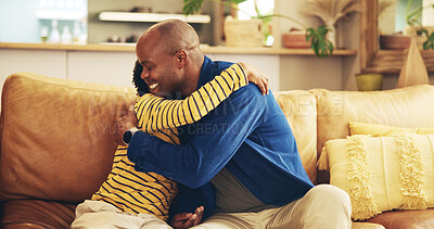 Buy stock photo Hugging, love or smile with dad and son on sofa in living room of home together for development. Black family, bonding or happy with boy child and single parent man embracing in apartment for support