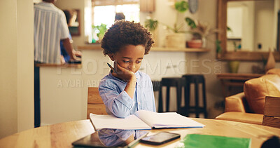 Buy stock photo Student, boy and homework with thinking in home for problem solving, learning development and education. Black child, books and studying at dining table for exam knowledge and assignment solution