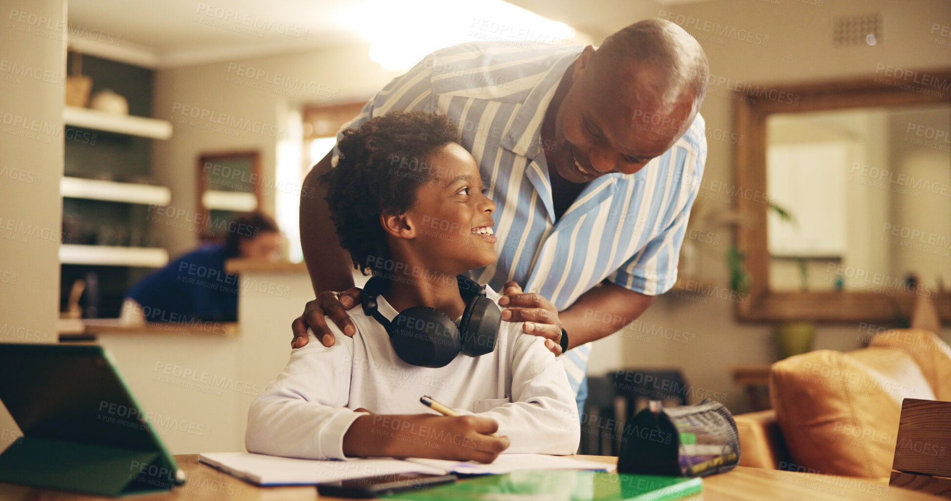 Buy stock photo Father, boy and happy with homework, learning and support for development, notes and advice in house. African man, child and scholarship with tablet, notebook and online course at black family home