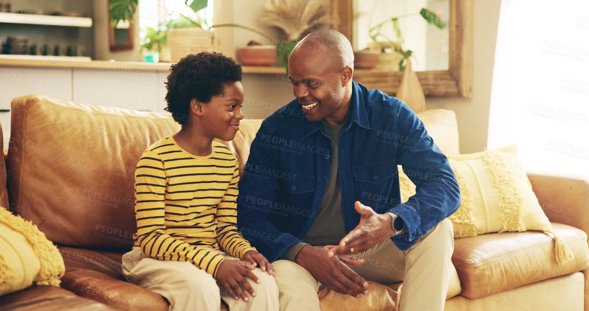 Buy stock photo Black family, smile or talking with dad and son on sofa in living room of home together for development. Bonding, happy or love with boy child and single parent man in apartment for advice or chat