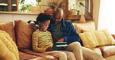 Buy stock photo Dad, child and tablet on sofa for elearning, bonding and educational app in home. Black family, man and son with tech for streaming subscription, growth and development for boy with online in lounge