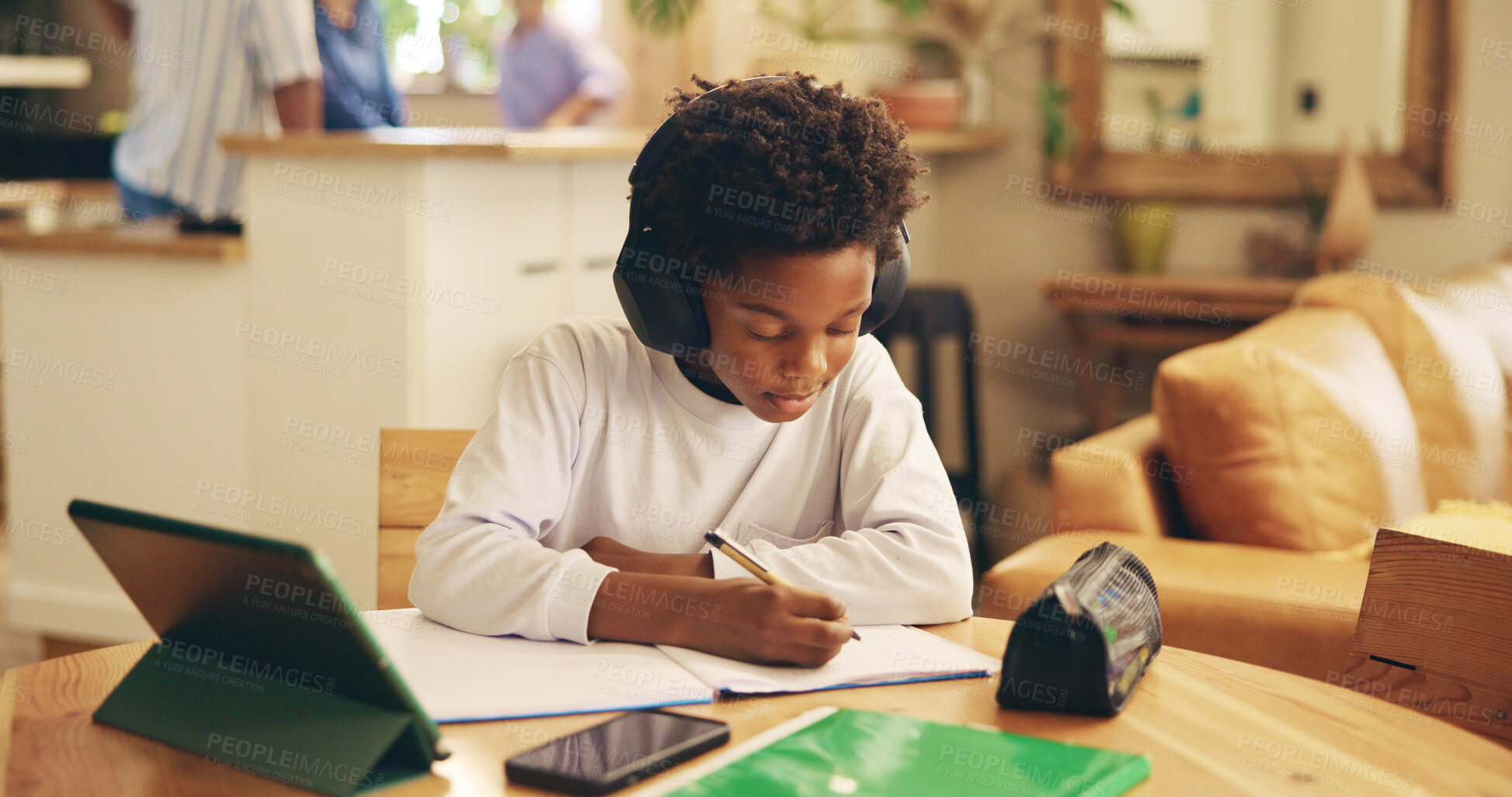 Buy stock photo Studying, education and child with headphones, writing and preparing for exam, African and serious. Home, online and practice for test, growth and development with podcast, boy or audio for knowledge