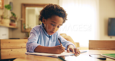 Buy stock photo Writing, education and child with homework, home and boy with info, serious and studying for exam. Desk, growth and development of African kid, knowledge and preparing for test with notebook in house