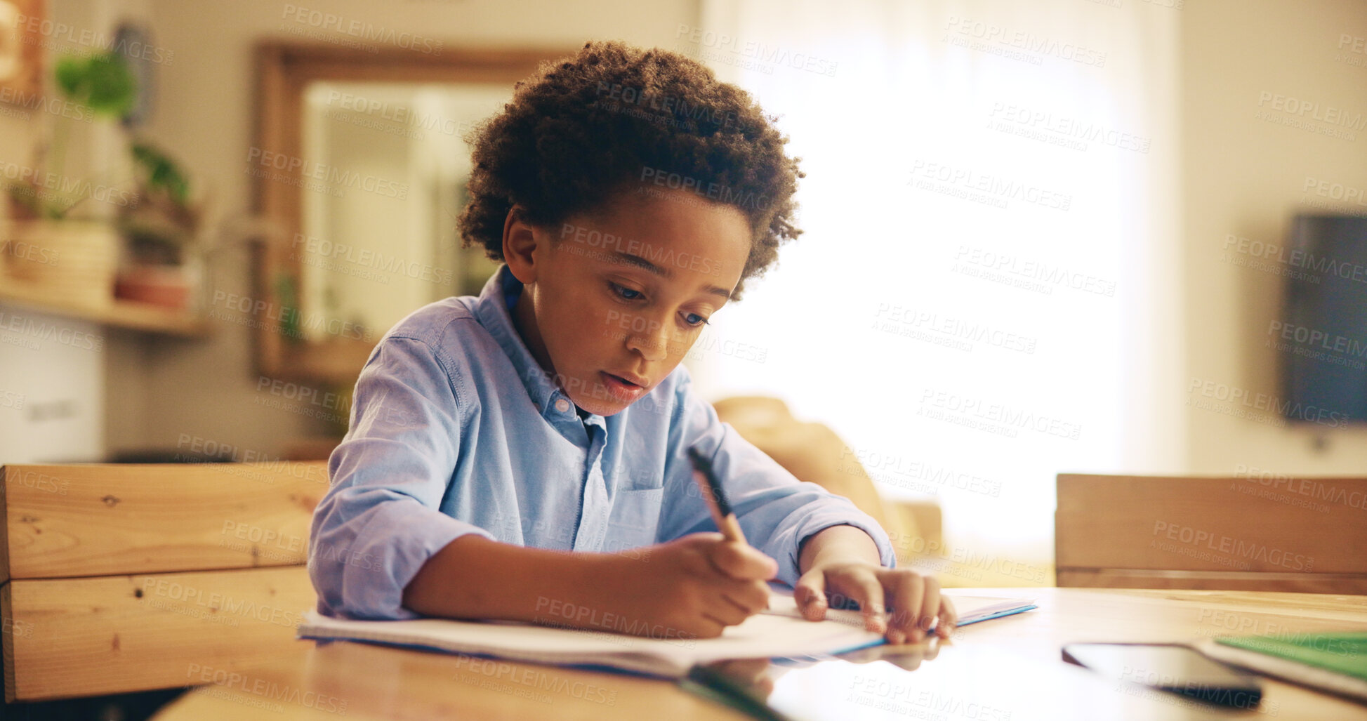 Buy stock photo Writing, education and child with homework, home and boy with info, serious and studying for exam. Desk, growth and development of African kid, knowledge and preparing for test with notebook in house
