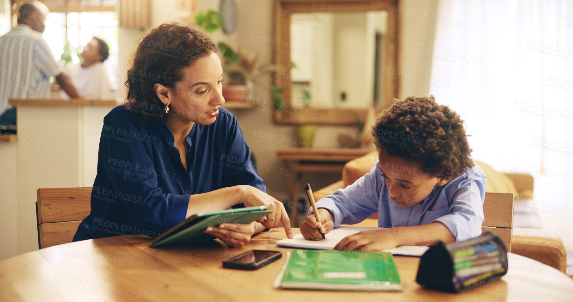 Buy stock photo Education, mother and child writing in home for learning, studying and advice for homework at tablet. Woman, son or books in living room for lesson, language development and information on technology