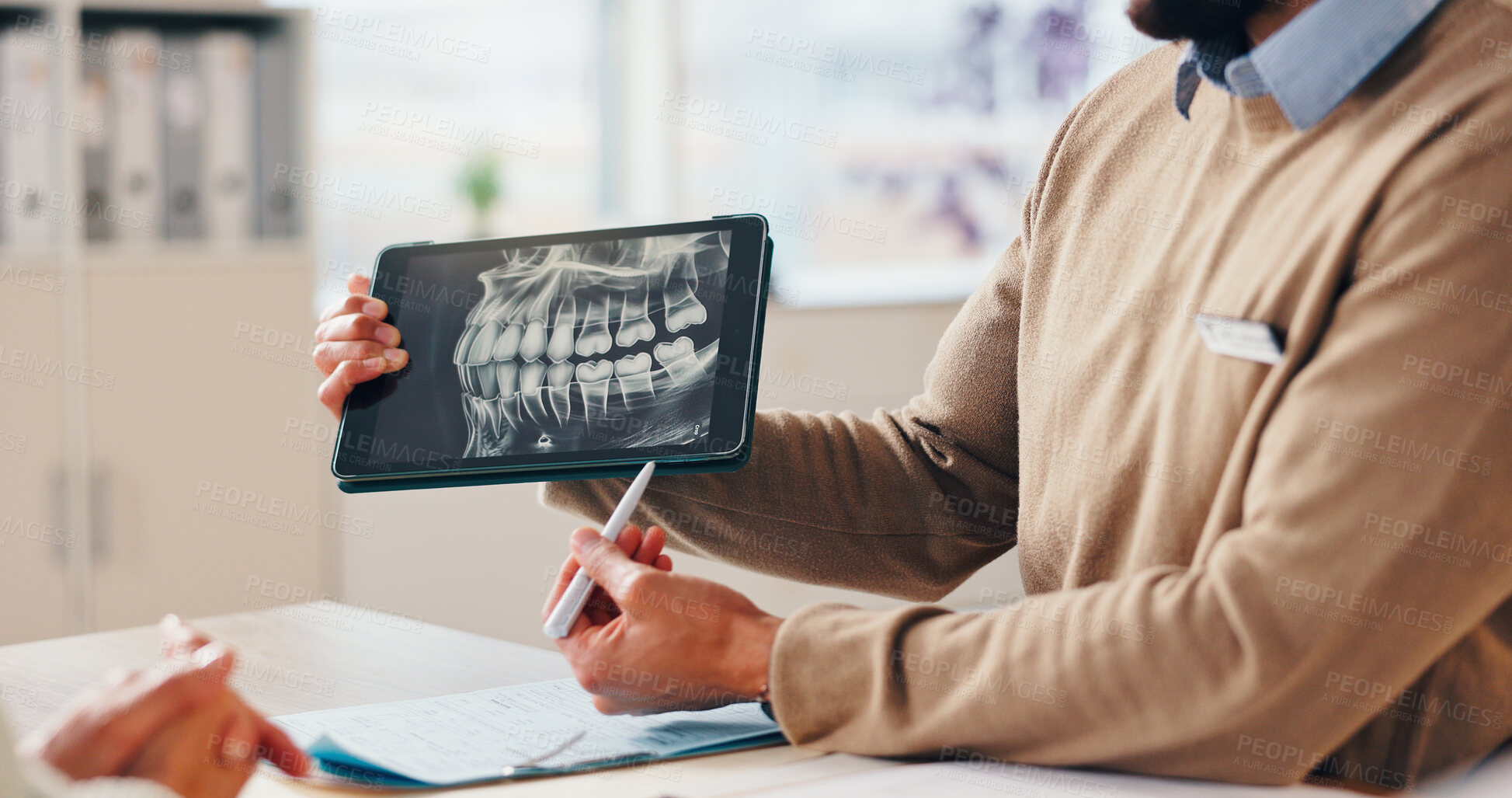 Buy stock photo Dentist hands, tablet and xray on screen for help, explain surgery or diagnosis with patient in office. Man, orthodontist or tech in practice for dental implant or teeth alignment procedure at person