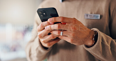 Buy stock photo Break, hands and businessman in office with smartphone for texting on social media, network and website. Badge, name tag and consultant with mobile in workplace for message, technology closeup or app