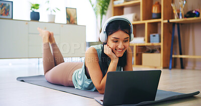 Buy stock photo Headphones, laptop and fitness with woman in living room for streaming service, online class and yoga. Social media, pilates and subscribe with person watching at home for health, audio and tutorial
