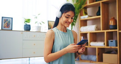 Buy stock photo Phone, woman and headphones with smile in home for audio playlist, streaming service and listening to radio. Girl, music and happy with track, song subscription and podcast for relax in living room