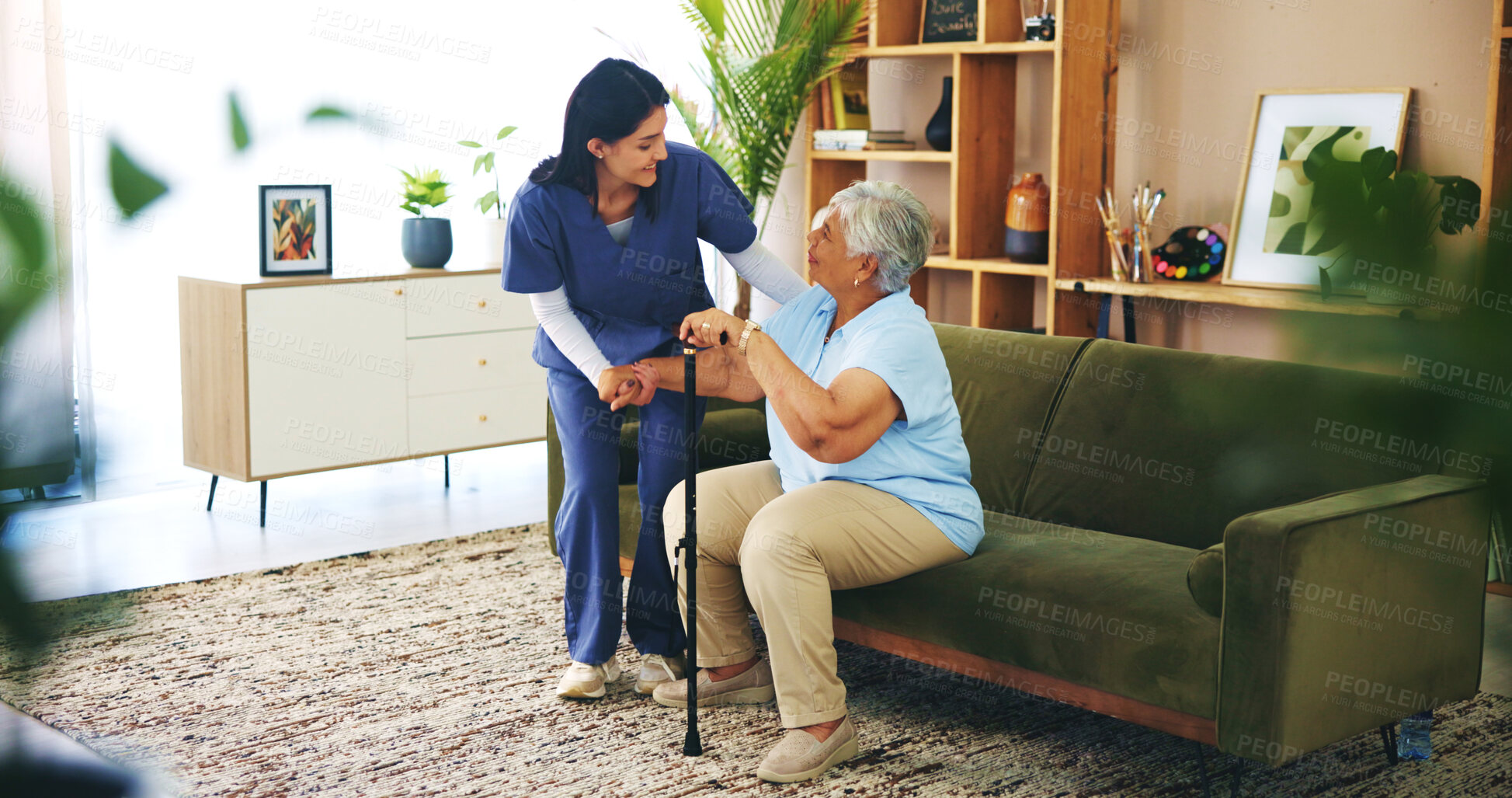 Buy stock photo Nurse, senior woman and help with walking stick in lounge for mobility, strength or assisted living. Elderly person, caregiver and cane in retirement or nursing home for health, wellness pr pensioner