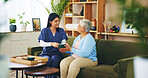 Elderly woman, nurse and tea in home for retirement support, relax or homecare assistance on sofa. Old person, caregiver or happy with beverage in morning for kindness, service or thank you in lounge