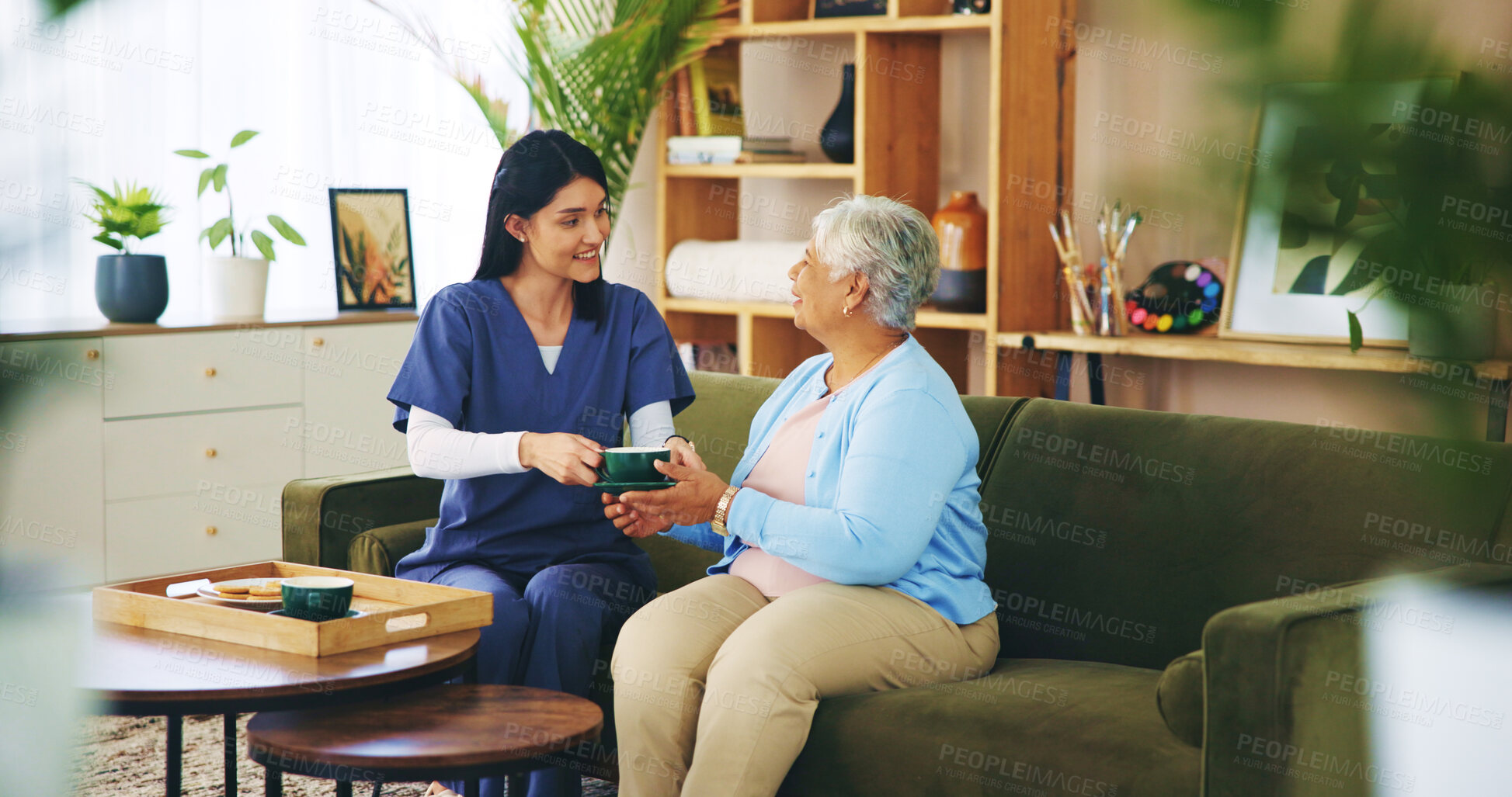 Buy stock photo Elderly woman, nurse and tea in home for retirement support, relax or homecare assistance on sofa. Old person, caregiver or happy with beverage in morning for kindness, service or thank you in lounge