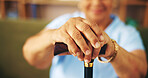 Elderly woman, cane and hands in portrait at retirement home for care, support or mobility. Senior, female person and walking stick in lounge for arthritis, injury and balance as closeup as pensioner