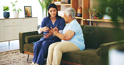 Buy stock photo Help, smartphone and old woman on sofa with nurse for senior care, support and learning in lounge at home. Homecare, elderly person and caregiver on couch with phone, healthcare and mobile app advice