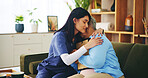 Picture, hug and old woman on sofa with nurse for senior care, support and grief counseling at home. Homecare, elderly widow and caregiver embrace on couch with memory, bonding and comfort in loss