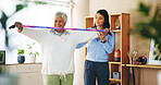 Elderly woman, resistance band and exercise with physiotherapist for fitness, wellness or muscle. People, training and support, performance and recovery in physiotherapy, workout and health in clinic