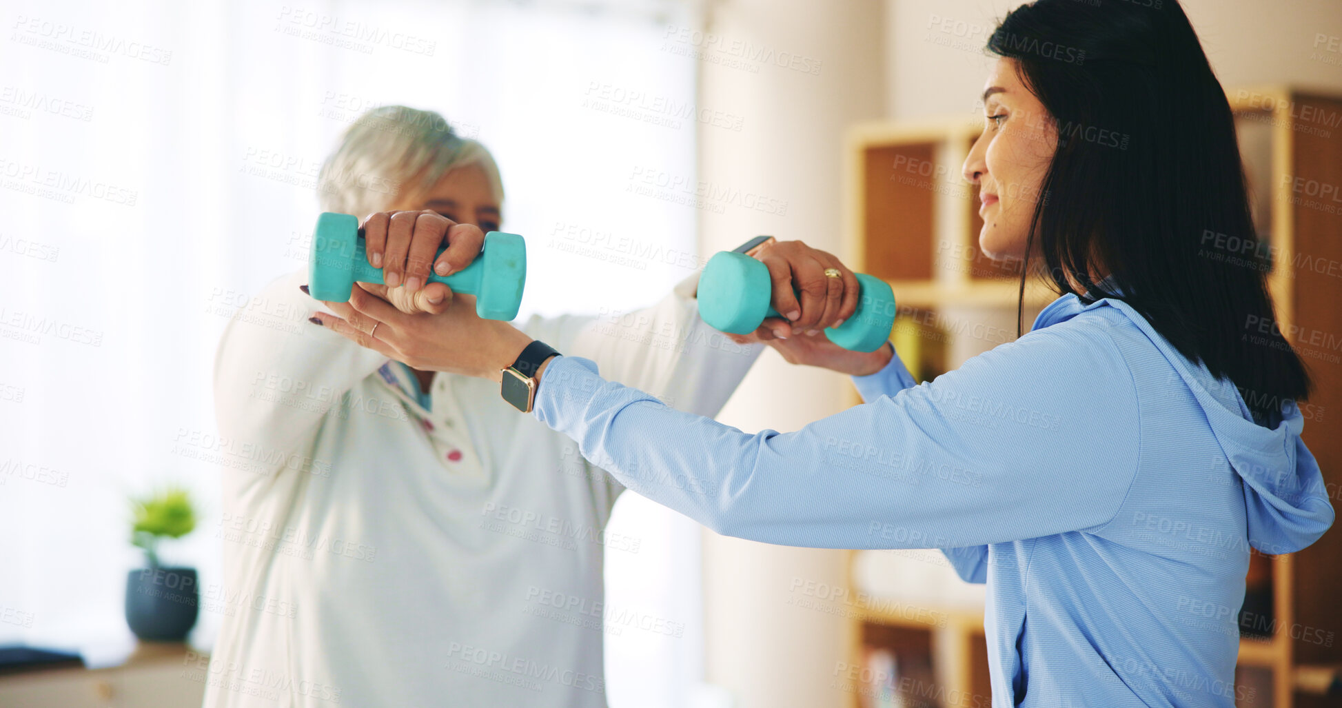 Buy stock photo Elderly woman, weight lifting and physiotherapist with dumbbell for fitness, wellness and muscle. People, pensioner and support for performance or recovery as physiotherapy, help and health in clinic