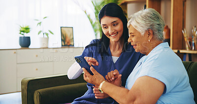 Buy stock photo Help, phone and old woman on sofa with nurse for senior care, support and smile in lounge at home. Homecare, elderly person and caregiver on couch with smartphone, healthcare and mobile app advice