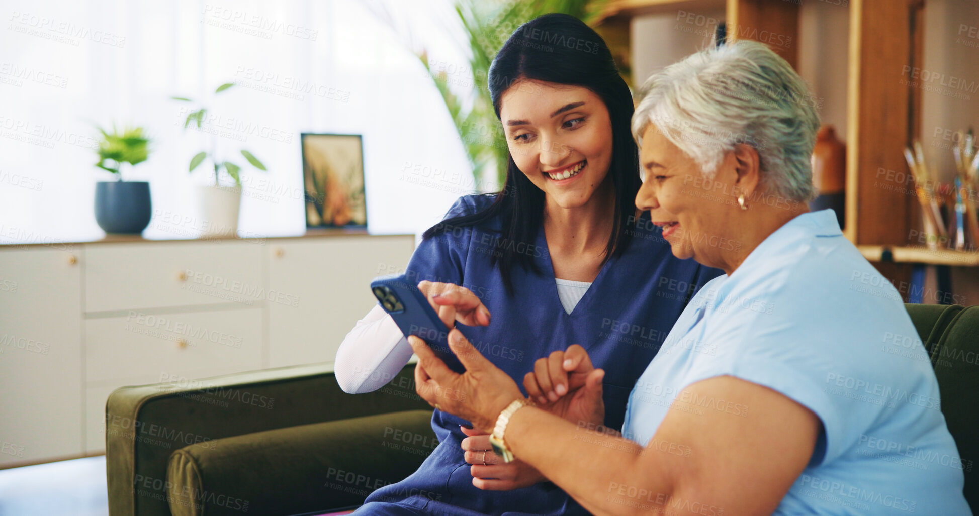 Buy stock photo Help, phone and old woman on sofa with nurse for senior care, support and smile in lounge at home. Homecare, elderly person and caregiver on couch with smartphone, healthcare and mobile app advice