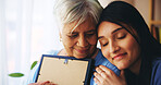 Senior woman, nurse and picture with support for grief, compassion and empathy with loss in home. Elderly care, caregiver and person hug photo frame for mourning, nostalgia and remember in retirement