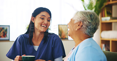 Buy stock photo Senior woman, nurse or laughing with tea in home for retirement support, funny conversation or homecare assistance. Old person, caregiver and joke with drink in morning for kindness, service or relax