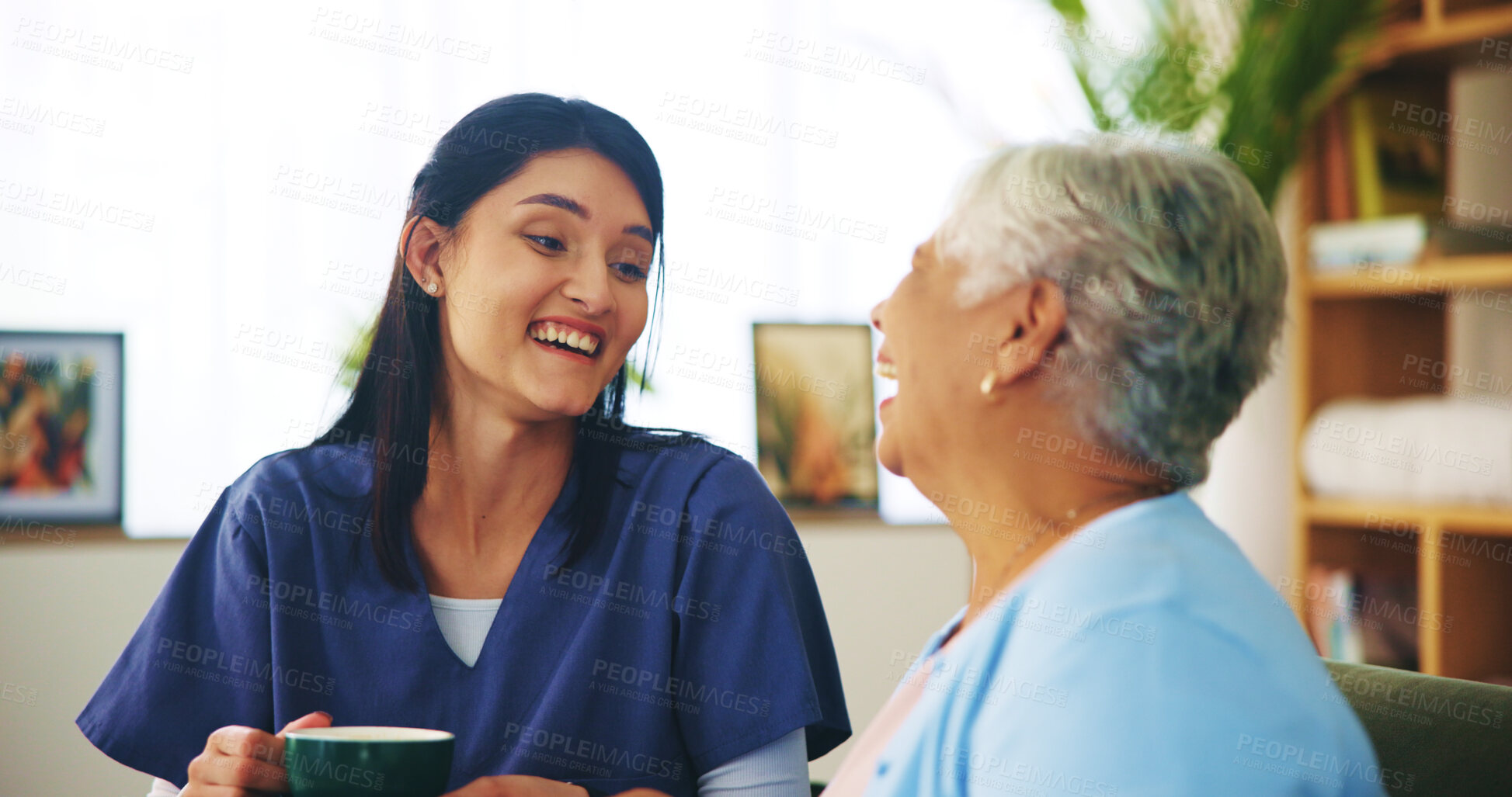 Buy stock photo Senior woman, nurse or laughing with tea in home for retirement support, funny conversation or homecare assistance. Old person, caregiver and joke with drink in morning for kindness, service or relax