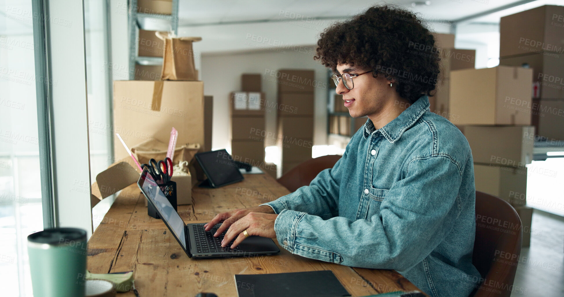 Buy stock photo Man, laptop or typing in business for logistics, order process or package tracking in office. Entrepreneur, computer or network in warehouse for startup management, supply chain or boxes for delivery