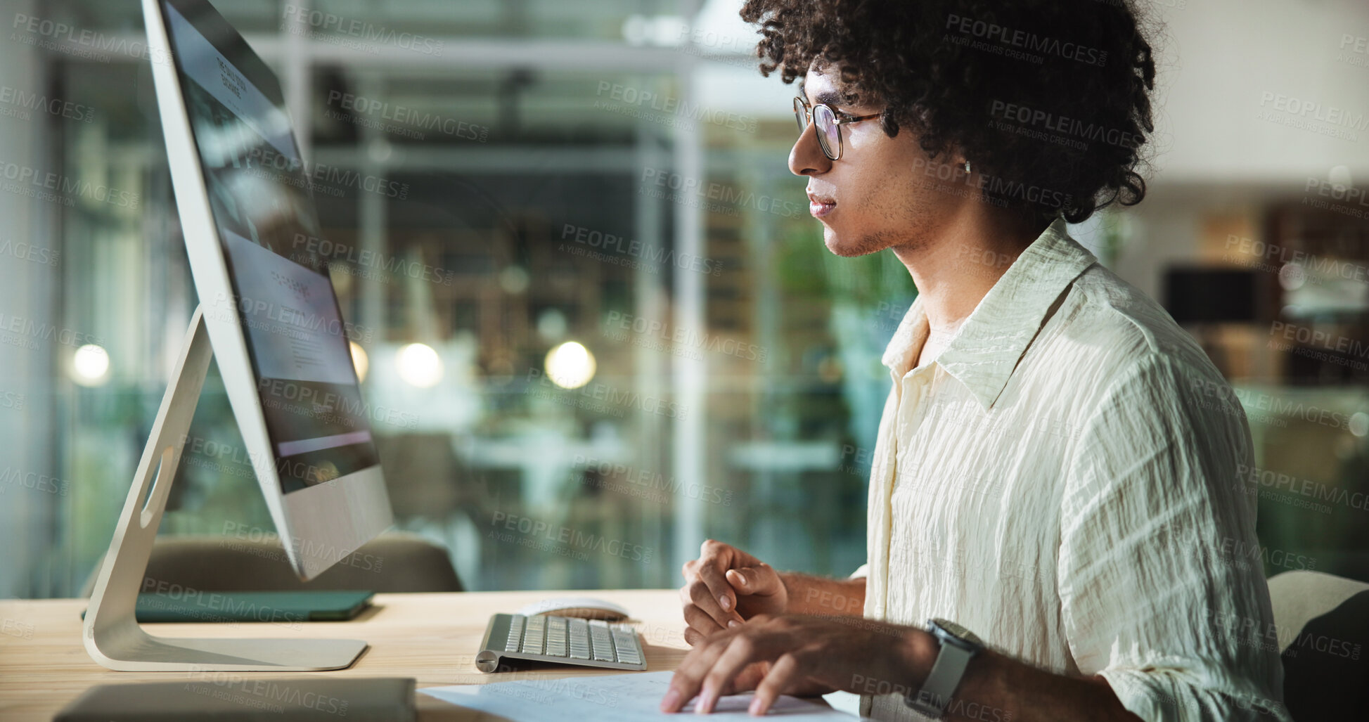 Buy stock photo Computer, night and business man in office for creative blog, article or content writer with paper. Desktop, startup and worker reading email for social media platform, project or story on overtime