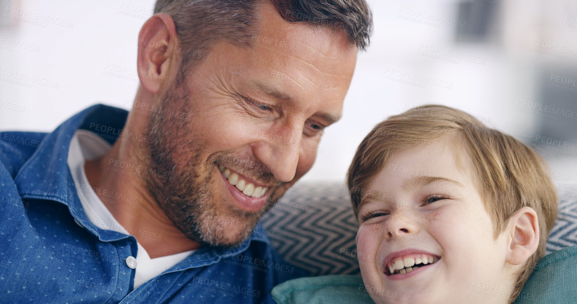 Buy stock photo Sofa, father and child with laughing for joke, connection and bonding together with funny conversation. Happy people, dad and boy on couch for relax, healthy relationship and parenthood at home