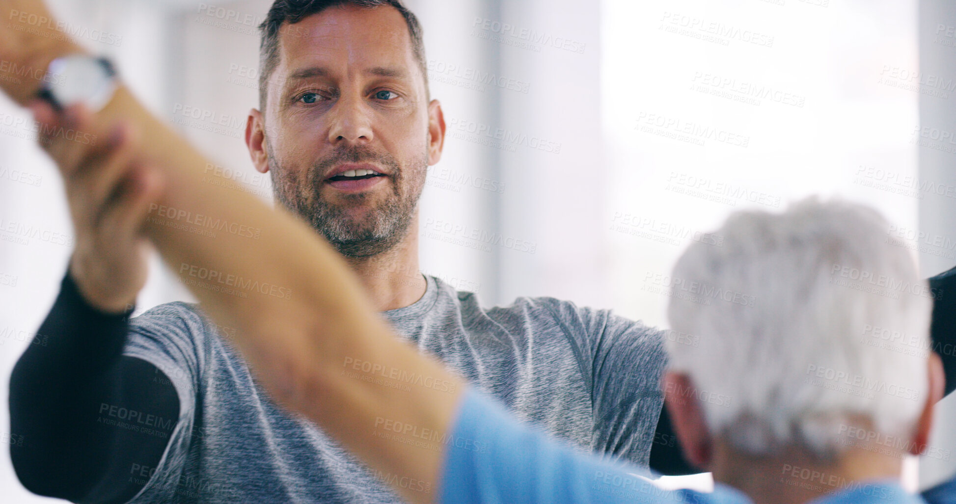 Buy stock photo Man, physiotherapist and elderly patient with stretching for mobility, physical activity or exercise. Male person, medical worker or client with physiotherapy for muscle or flexibility at hospital