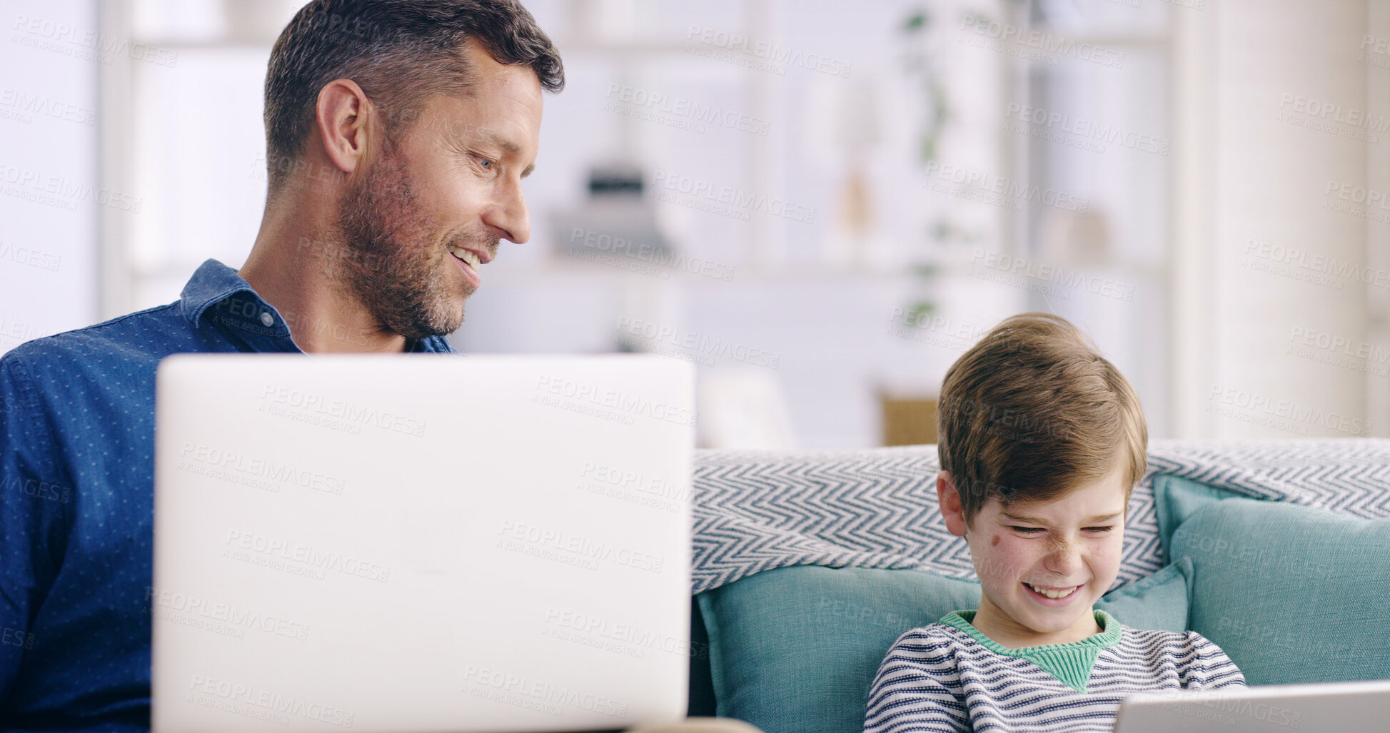 Buy stock photo Happy, dad and child with laptop or tablet in home for connectivity, bonding or streaming online for comedy. Family, father and boy on couch with technology, movie or cartoon for learning or laughing
