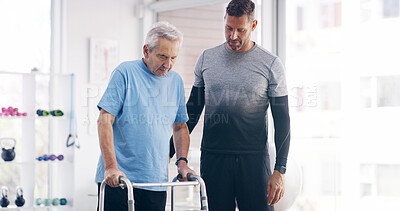 Buy stock photo Man, physiotherapist and elderly patient with walker for mobility, physical activity or progress at clinic. Male person, medical worker or senior with physiotherapy for support or aid at hospital