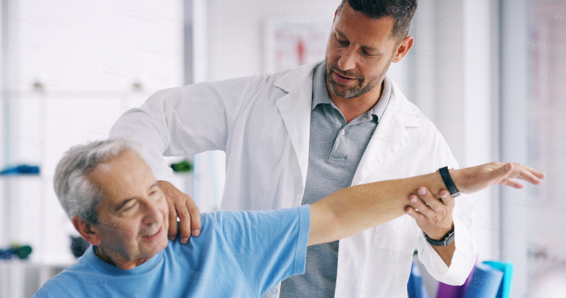 Buy stock photo Senior person, stretching arm and man in physiotherapy for help, recovery or exercise for healing. Elderly patient, chiropractor or exam in practice for muscle care, strengthen shoulder or healthcare