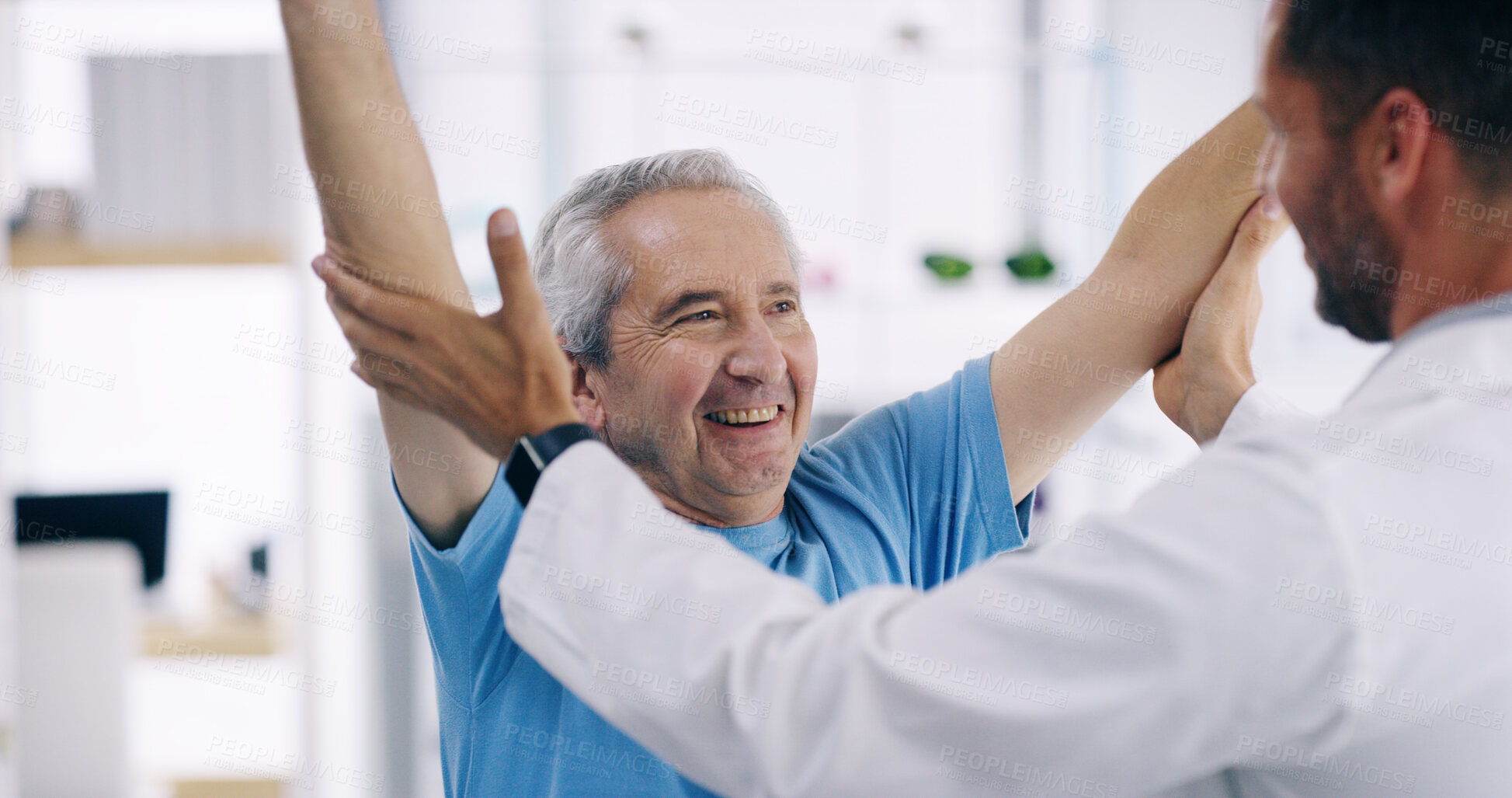 Buy stock photo Happy man, elderly patient and stretching with physiotherapist for physical examination, checkup or visit at clinic. Male person, medical worker or client with smile for physiotherapy at hospital