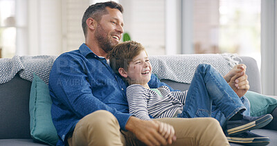 Buy stock photo Happy dad, child and relax with hug on sofa for holiday, bonding or weekend together at home. Parent, son or kid with smile or laugh for funny entertainment, comedy or fathers day on couch at house