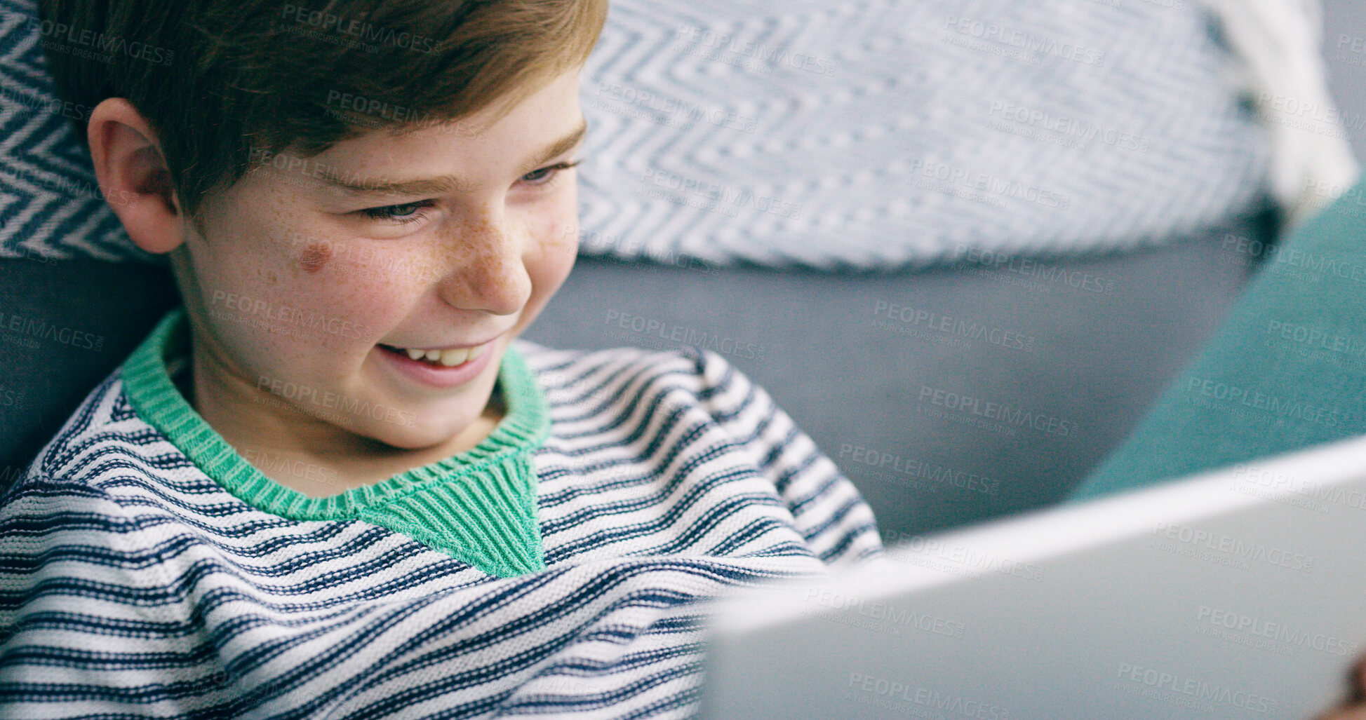 Buy stock photo Child, happy and relax in home with tablet, entertainment or interactive game app. Boy kid, tech or smile in living room with streaming platform, funny cartoon or online media in subscription service