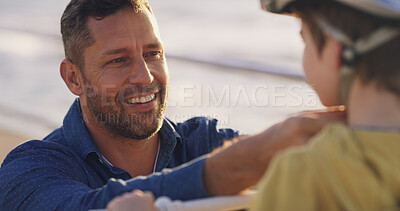 Buy stock photo Happy dad, child and helmet with help for protection, learning or teaching son to ride a bike in neighborhood. Parent, kid or boy with safety for cycling, bicycle lesson or practice at outdoor park