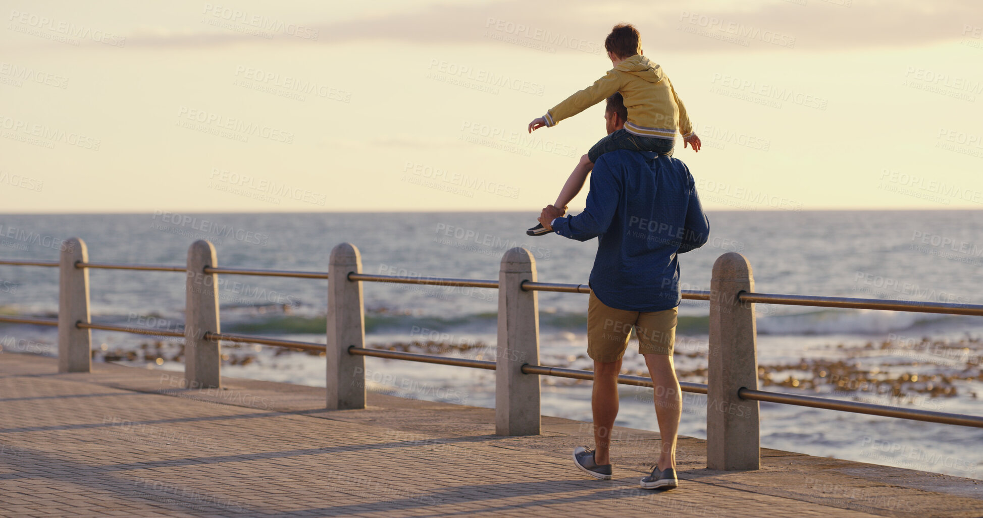 Buy stock photo Dad, son and piggyback at beach on holiday, adventure and outdoor for bonding with father. Back, child and papa for vacation security in relationship, curious kid and flying for love or care on trip