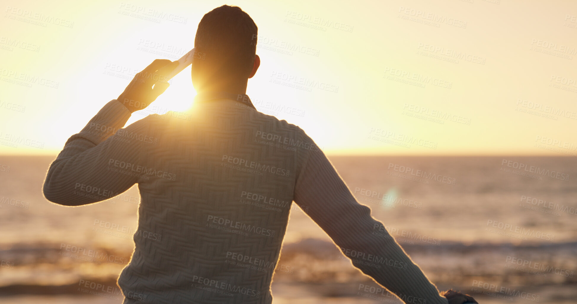 Buy stock photo Phone call, sunset and back of man at beach for communication, travel and contact. Networking, holiday and thinking with person and mobile with view for reflection, technology and connection