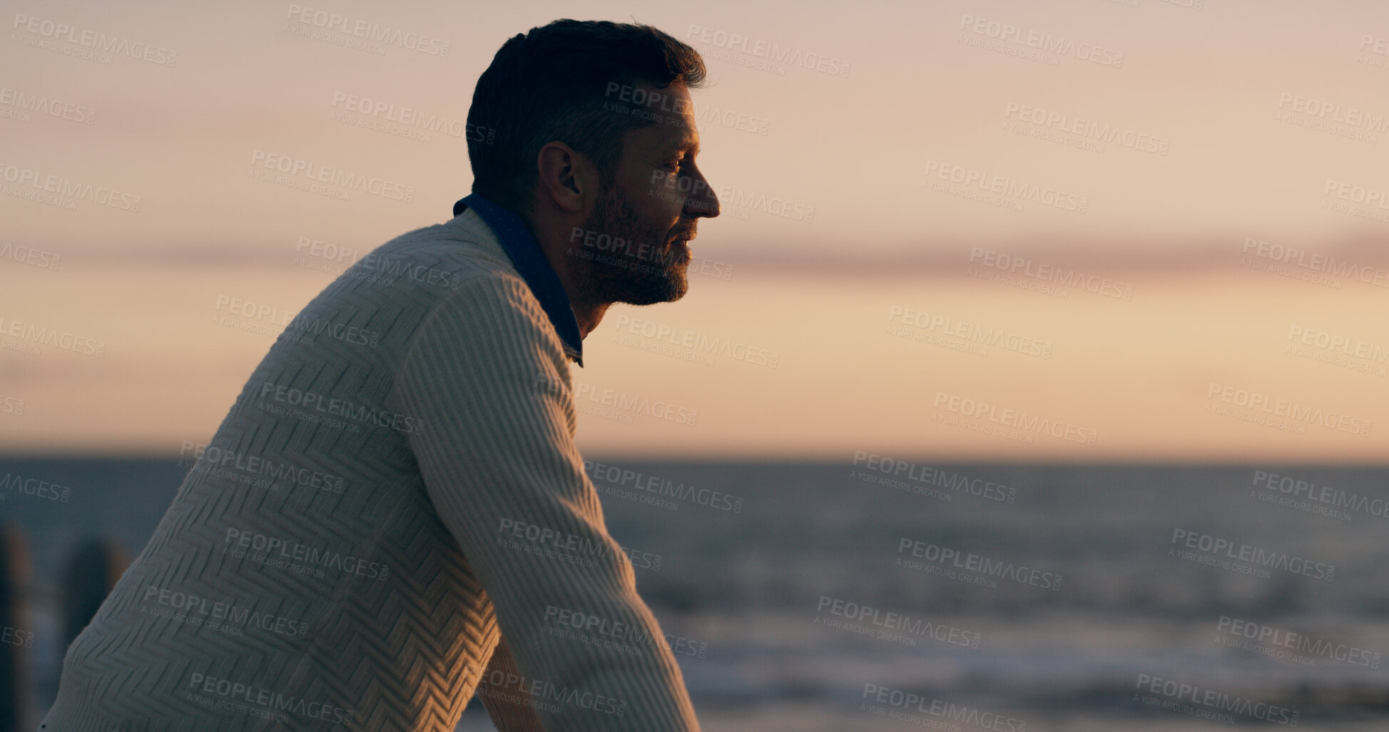 Buy stock photo Man, thinking and outdoor by sea, sunset or promenade in summer with decision in evening on break. Person, pier and inspiration by ocean, beach or reflection with sky, profile and dusk in New Zealand